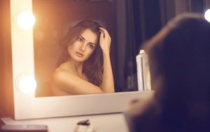 woman-looking-into-mirror-at-herself