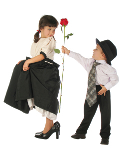 Little boy and girl with red rose