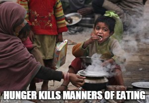 poor Indian boy eating
